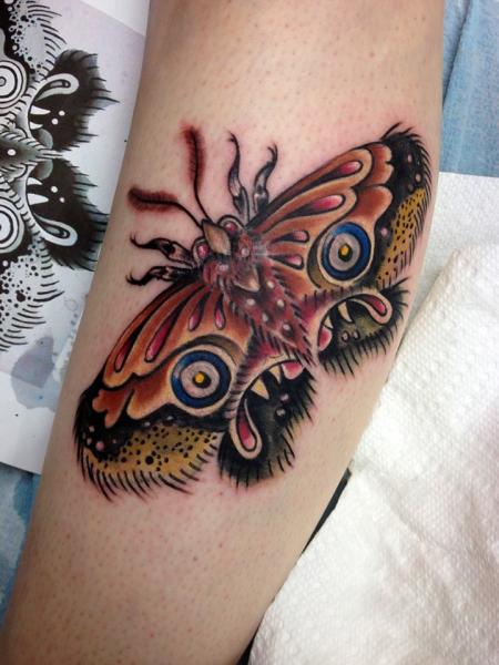 Creepy Face Moth Wings tattoo by Tantrix Body Art