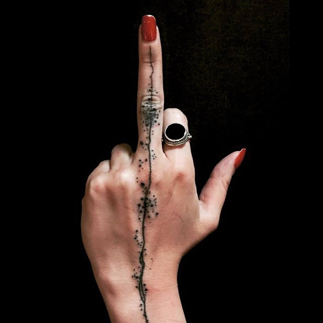 Splashed Line Middle Finger tattoo