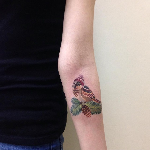 arm tattoo of a little bird sparrow