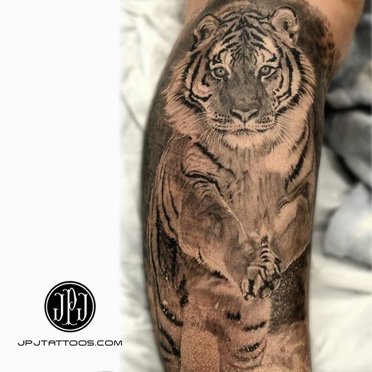 amazing realistic tiger running. Tattoo on shoulder