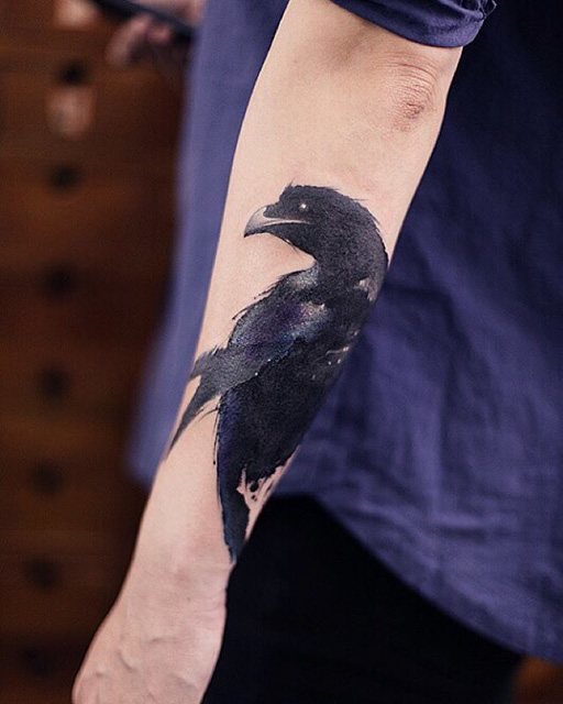 raven black tattoo on forearm