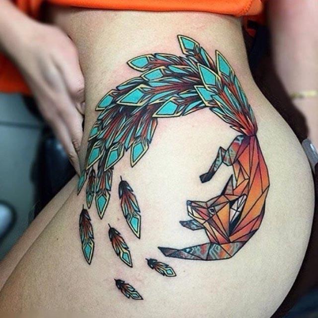 fox tattoo with feather tail