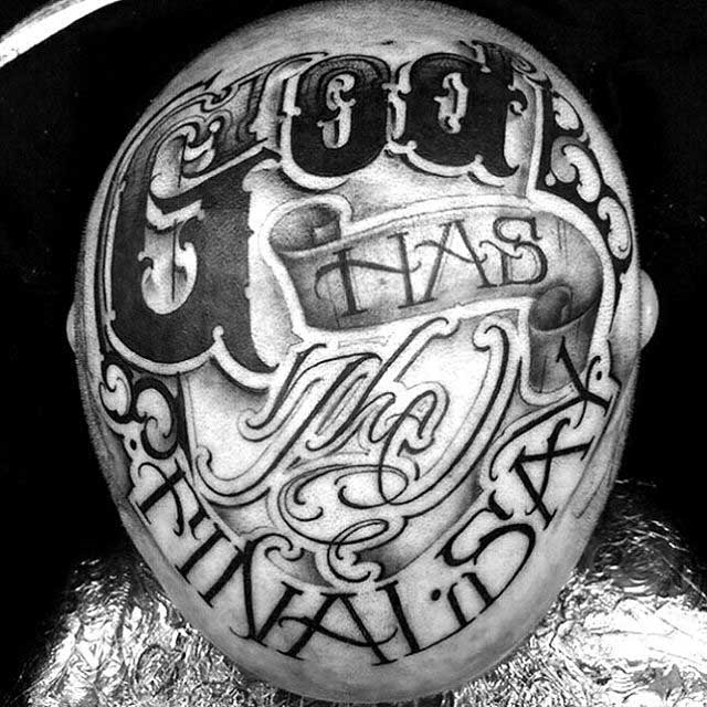 lettering chicano tattoo on head