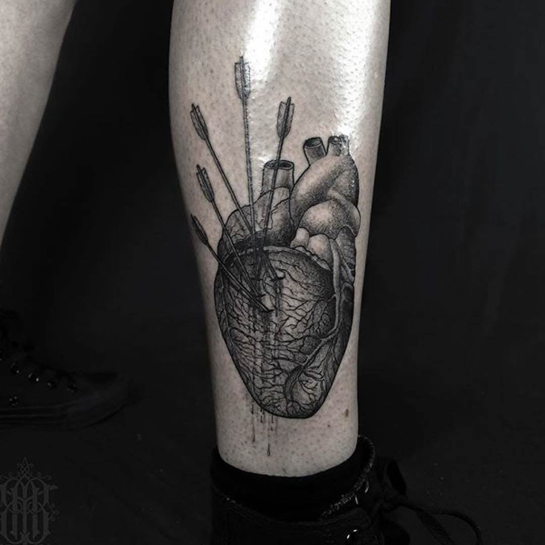arrows in heart tattoo