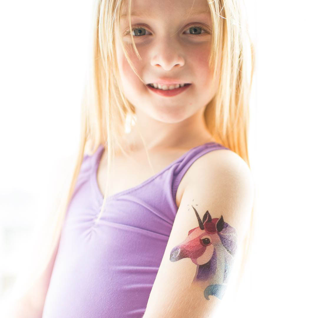 kid with a unicorn tattoo