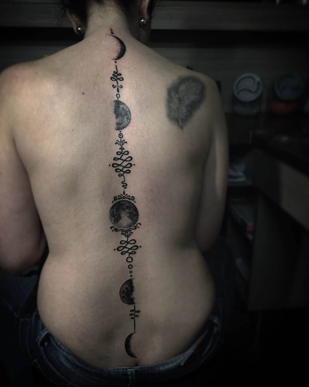 Moon Phases Tattoo on Spine by danistattoo