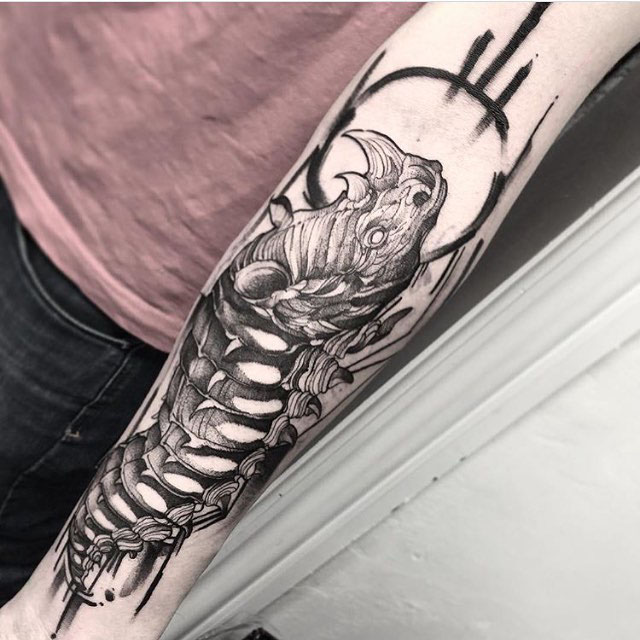 arm tattoo rhino caterpillar
