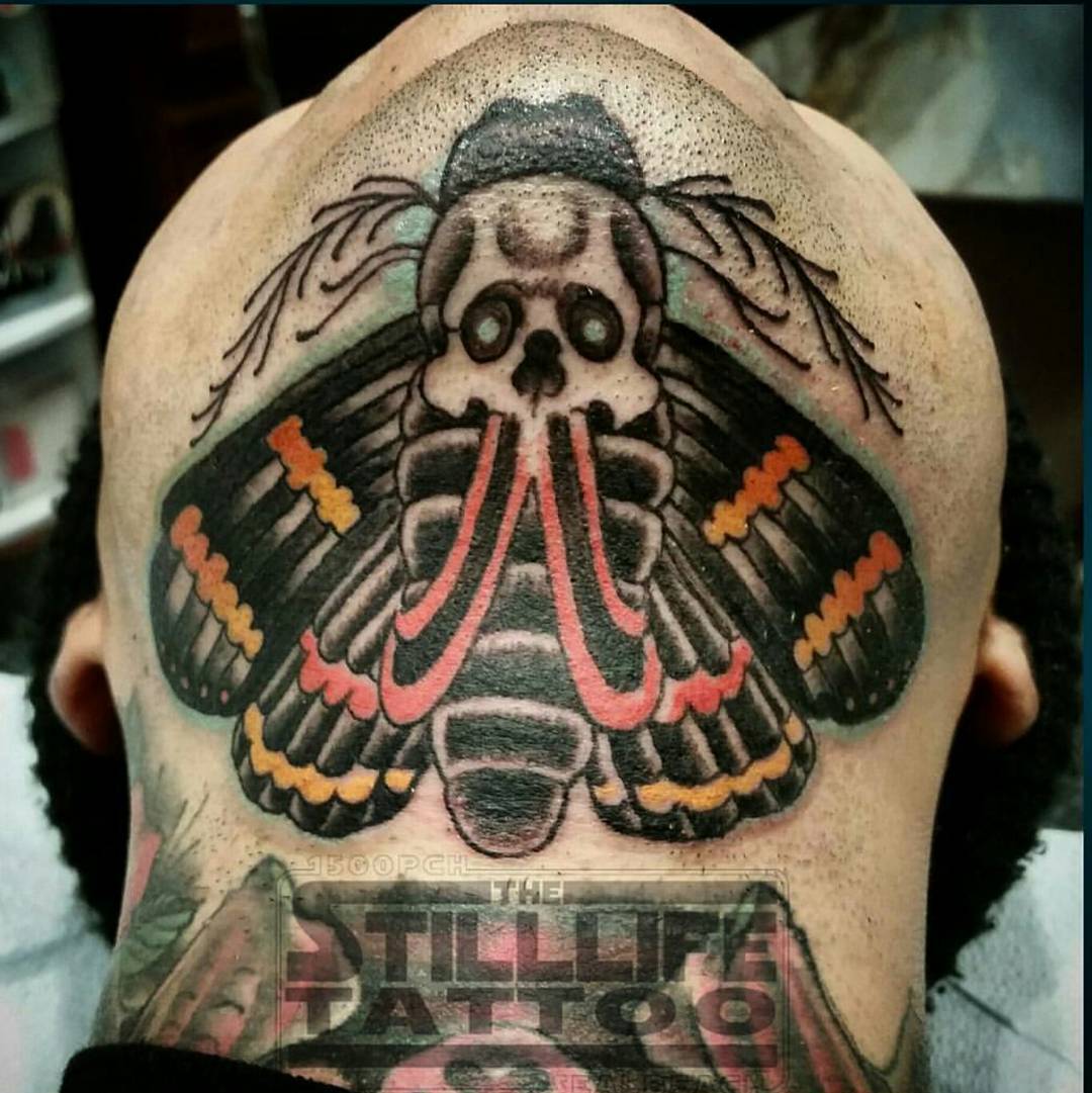 Skull Moth Tattoo Under Chin by @shelltoon