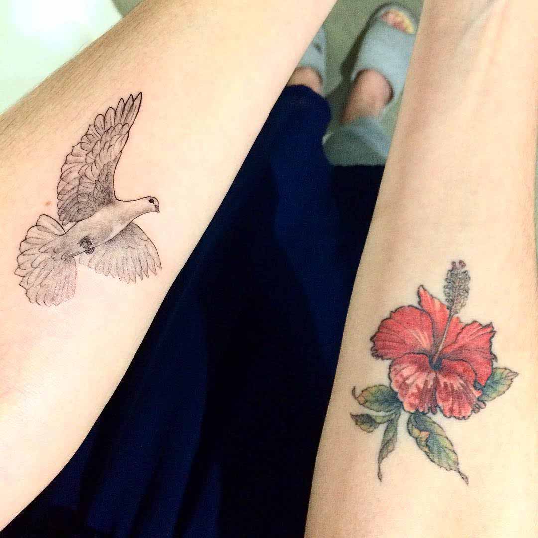 arm tattoos dove and flower