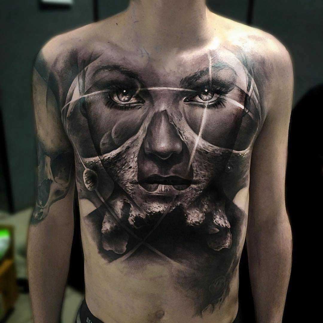 chest tattoo face portrait mixed with skull