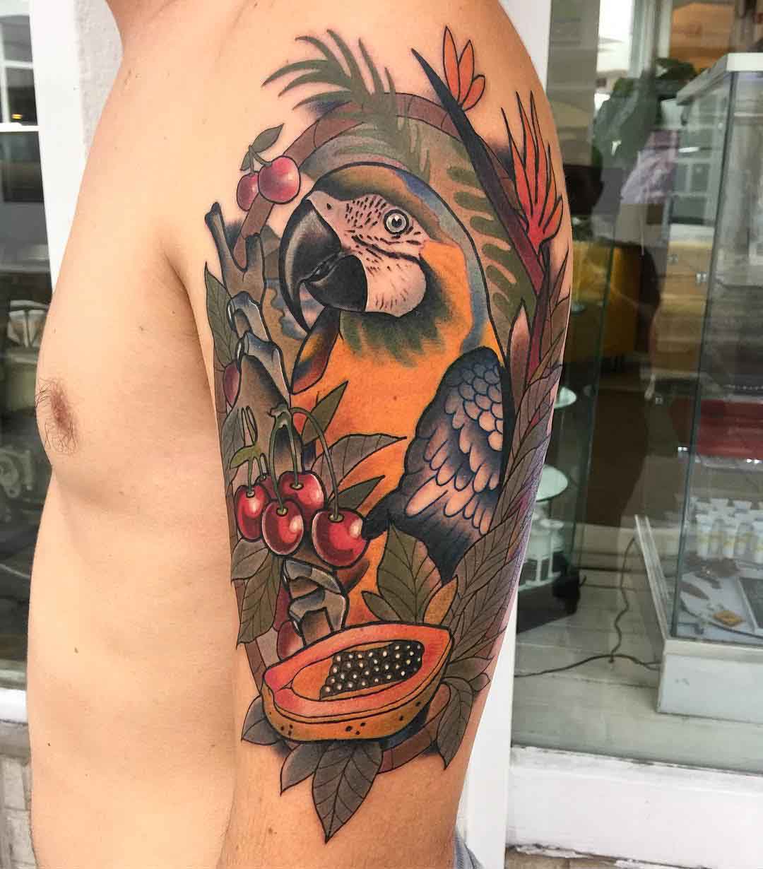 parrot tattoo on shoulder with fruits