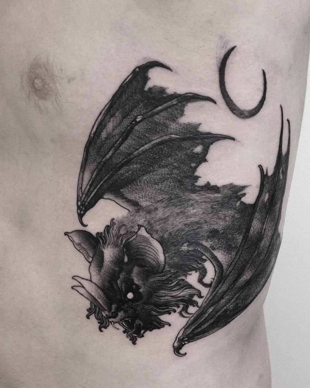 bat tattoo on ribs