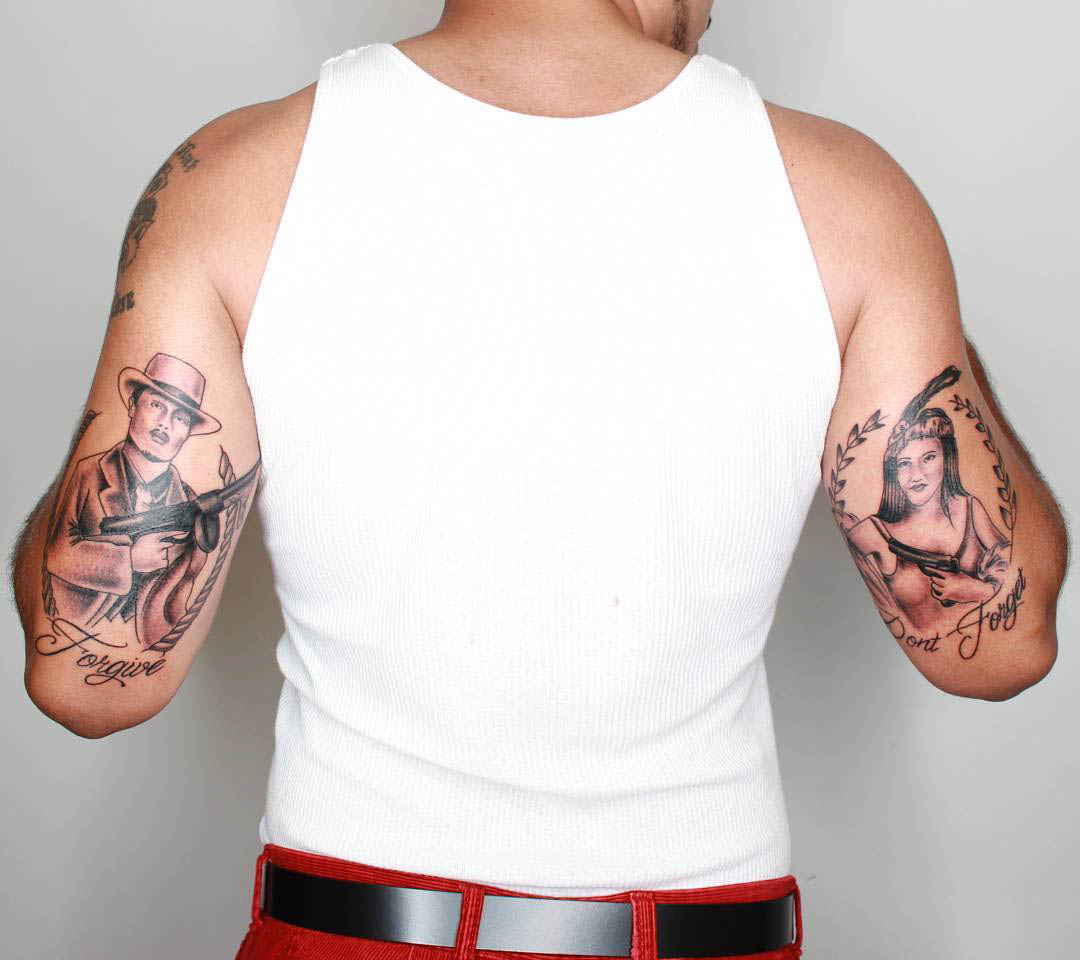 gangster tattoos on back of arm