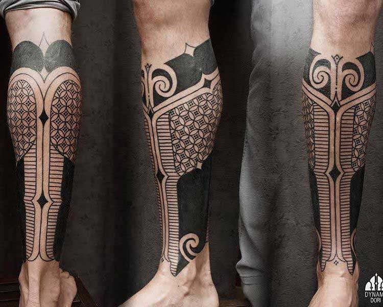 tribal tattoo on leg with geometric elements