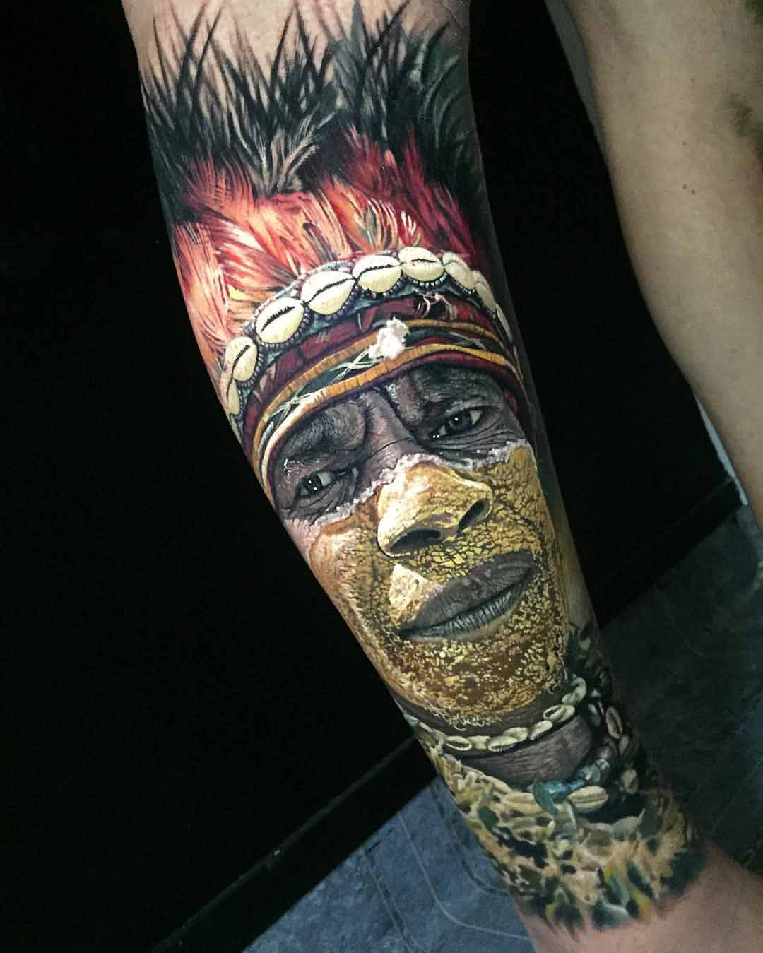 Indian man realistic portrait tattoo on arm