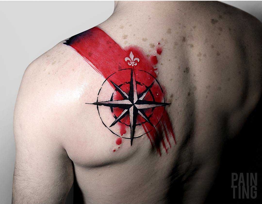 red paint tattoo nautical star on shoulder blade