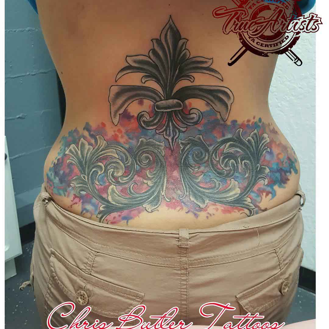 lwer back tattoo lily watercolor style
