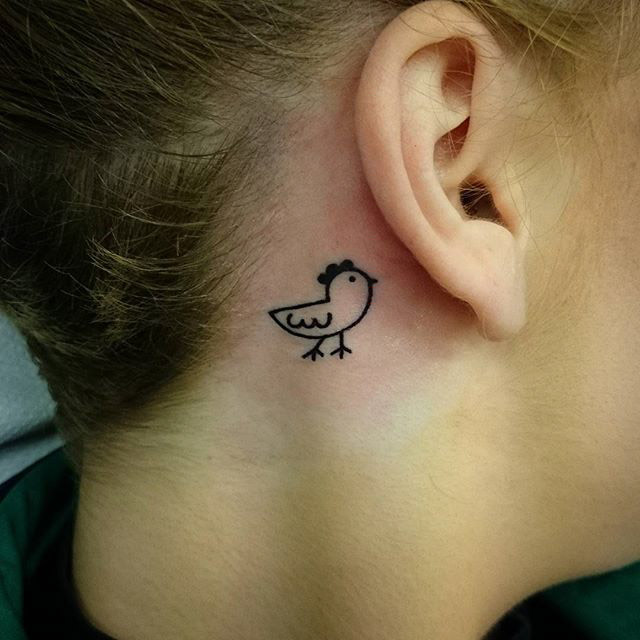 chicken outline tattoo behind the ear