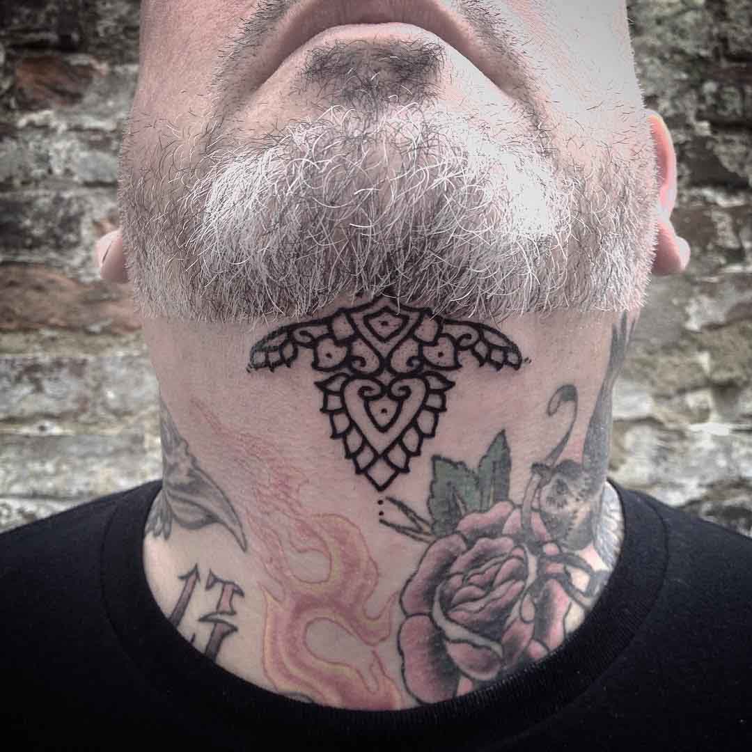 simple tattoo under chin