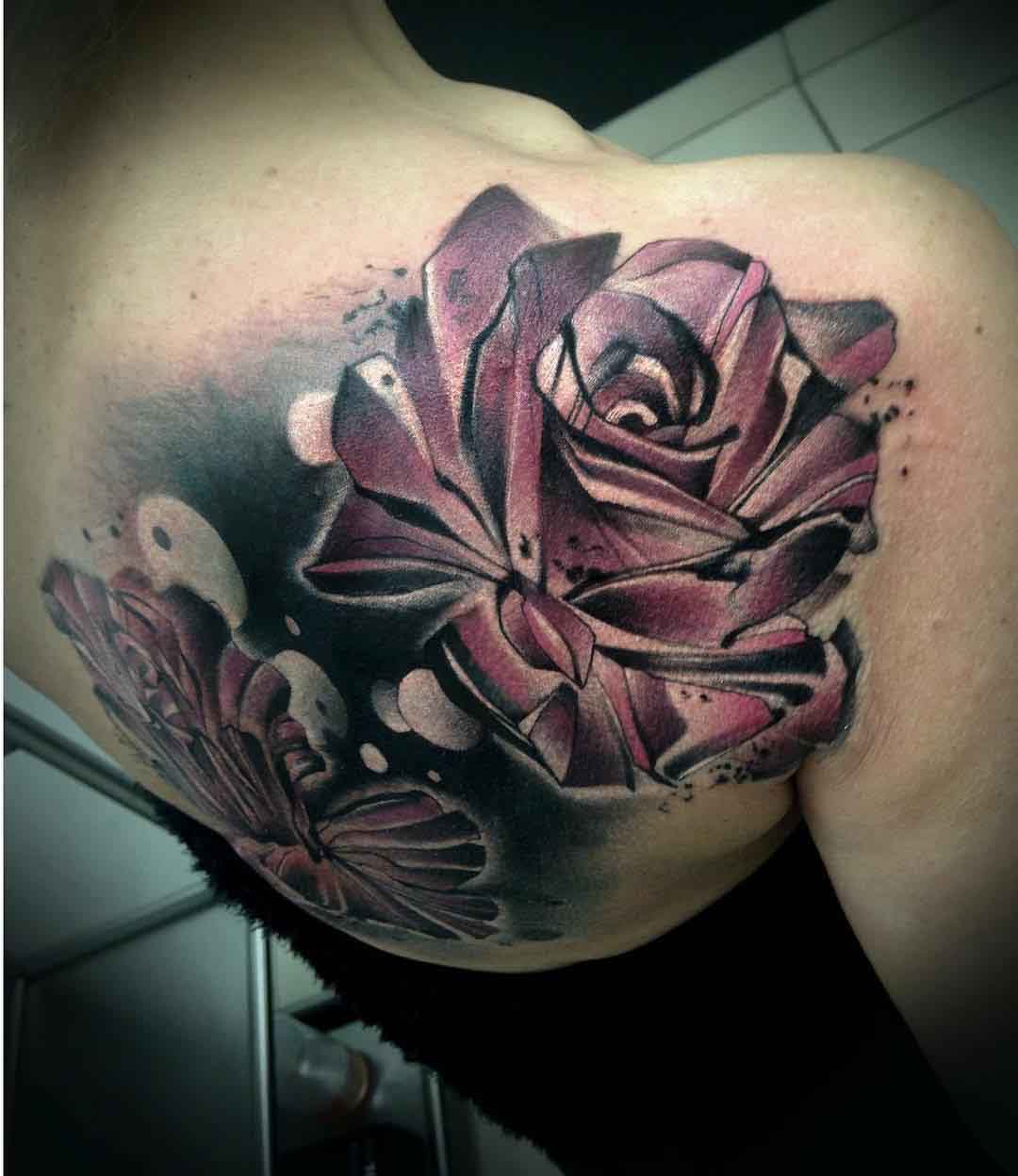 shoulder blade roses tattoo on girl