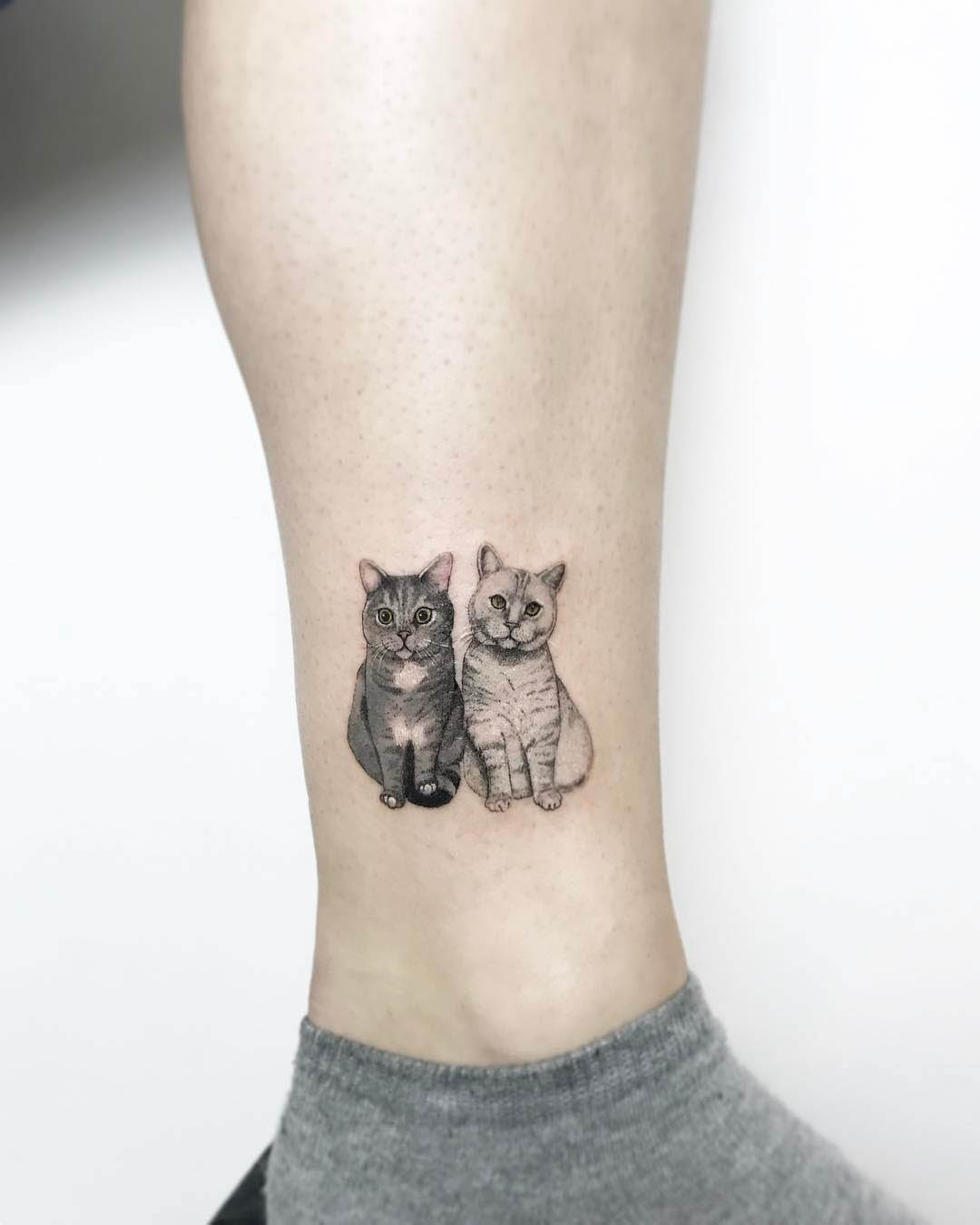 Small cats tattoo on ankle
