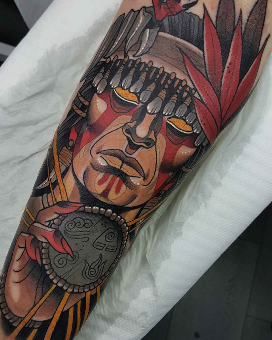 arm tattoo shaman face