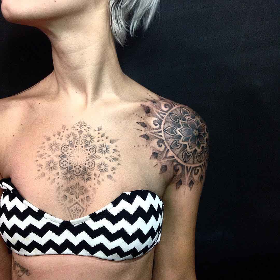 dotwork mandala tattoo on chest and shoulder