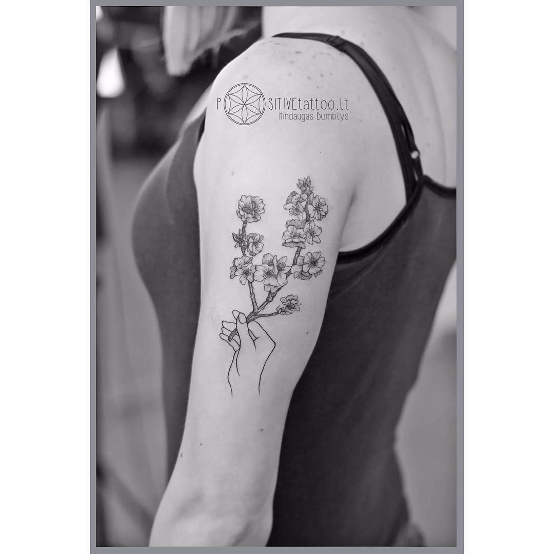 shoulder tattoo branch in bloom