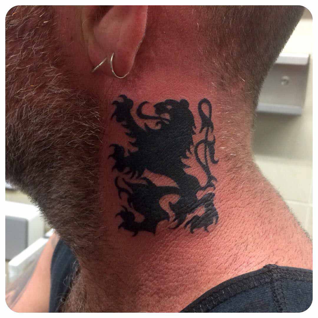 heraldic lion tattoo on neck