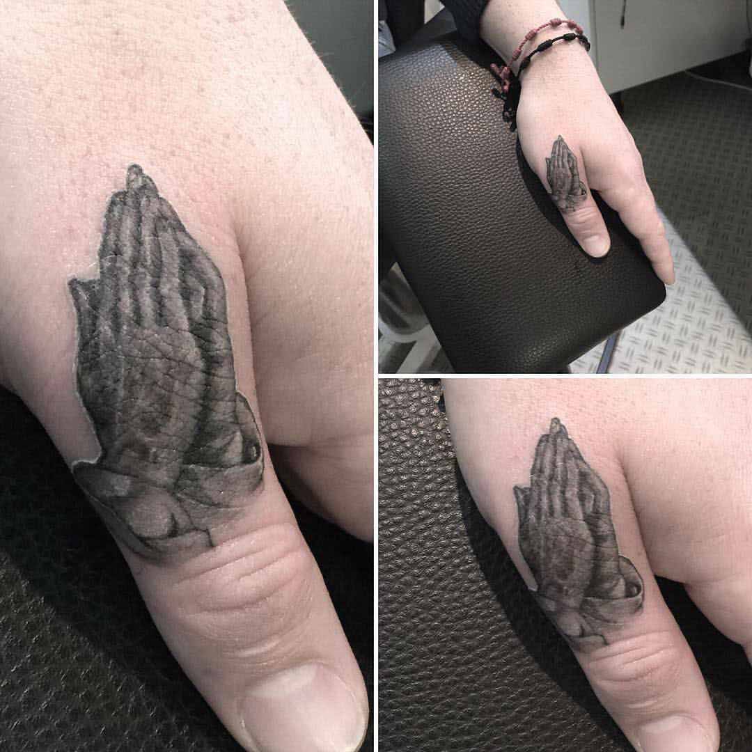 thumb religious tattoo