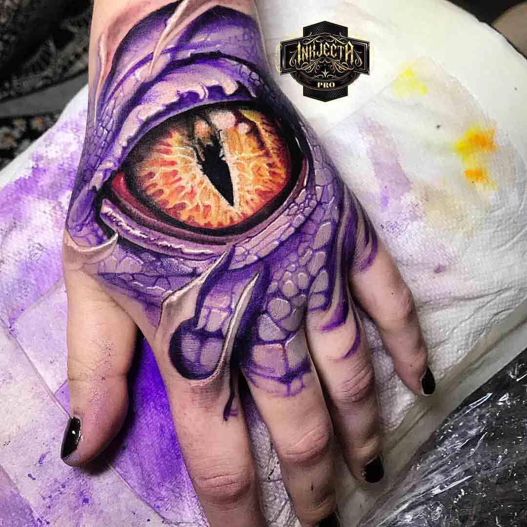 hand tattoo eye of a dragon