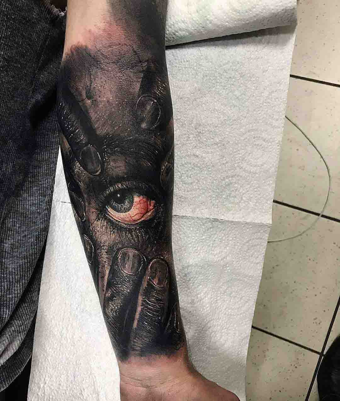 arm tattoo eye realistic style