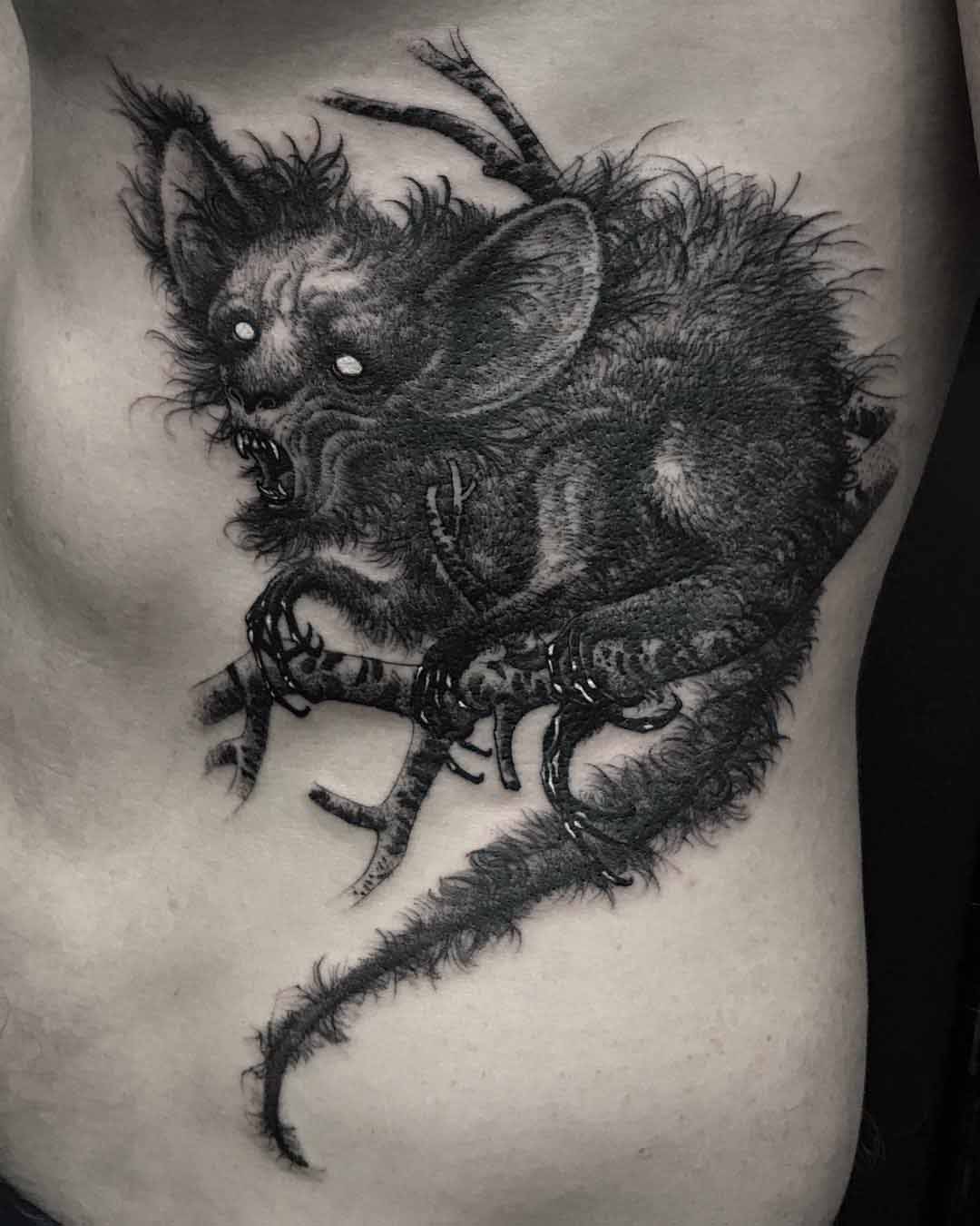 rib tattoo chupacabra monster