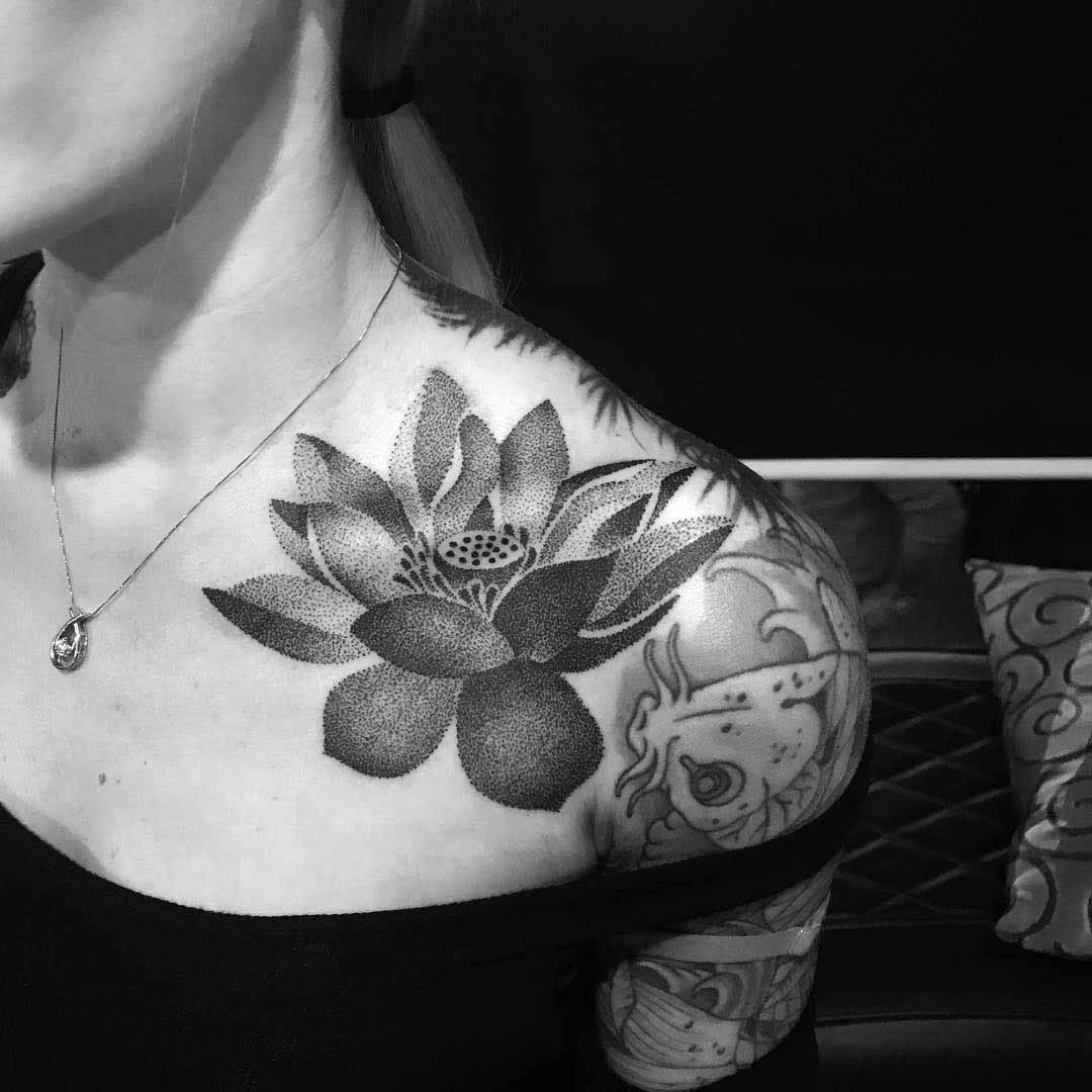 dotwork tattoo lotus flower on collar bone