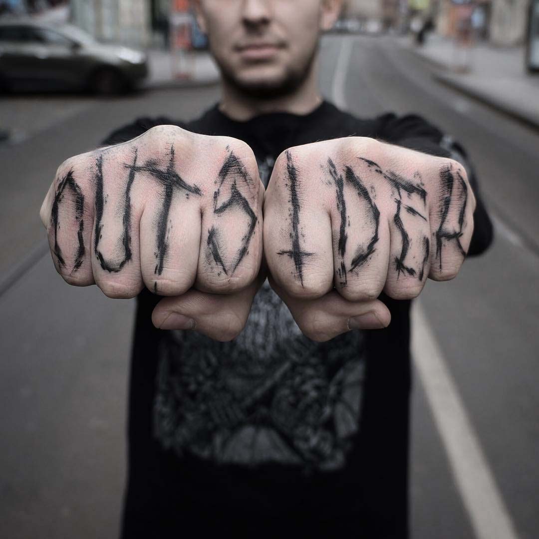 finger tattoo outsider lettering