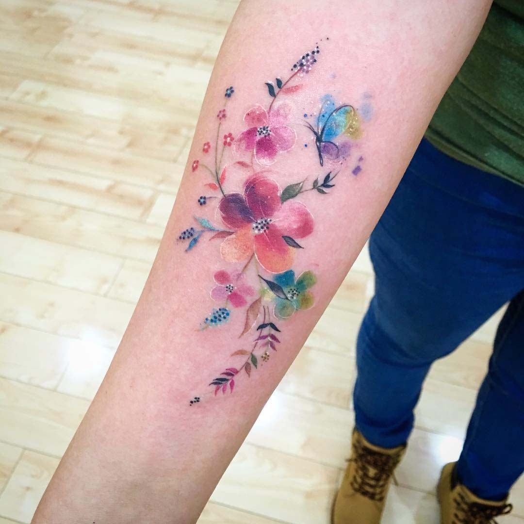 arm tattoo floral watercolor style