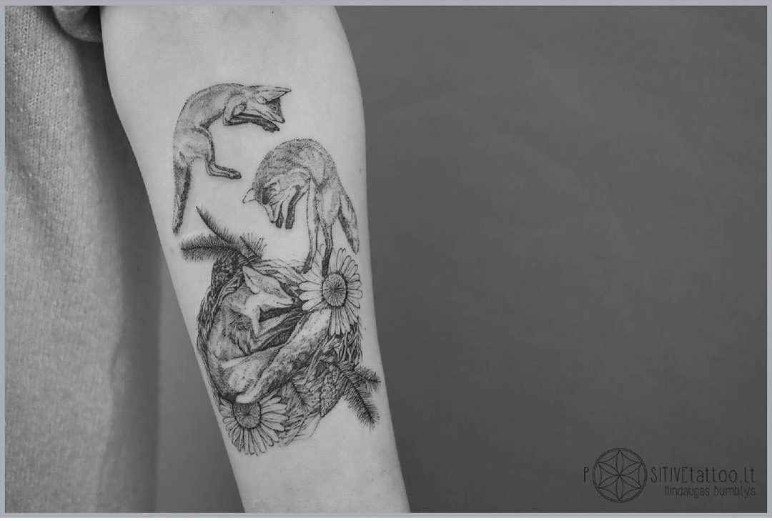arm tattoo three foxes