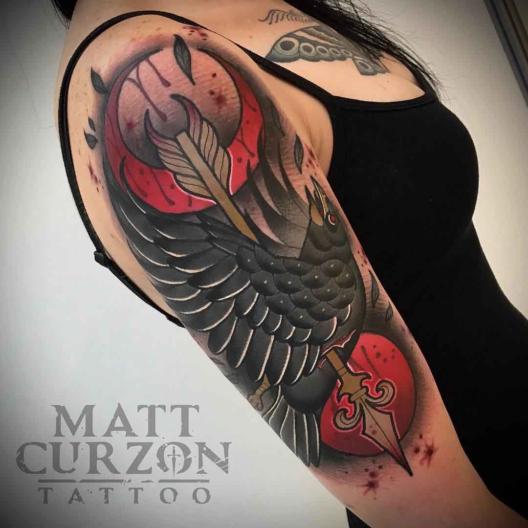 neo-traditional shoulder tattoo crow with arrow
