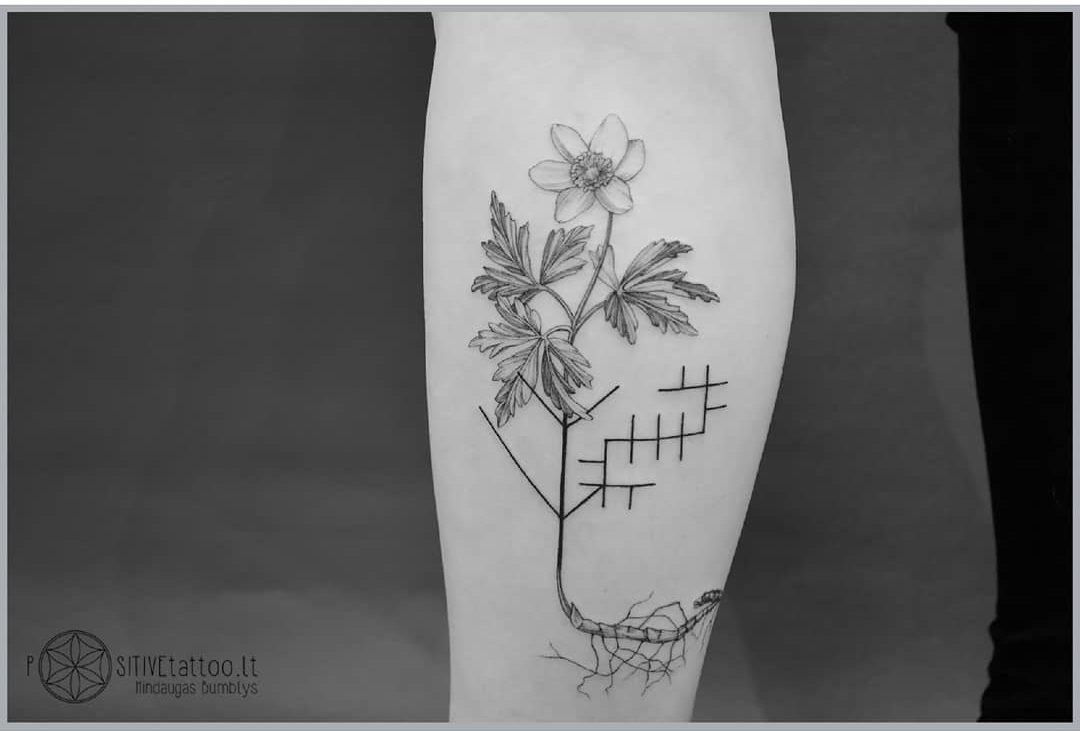 flower tattoo on calf