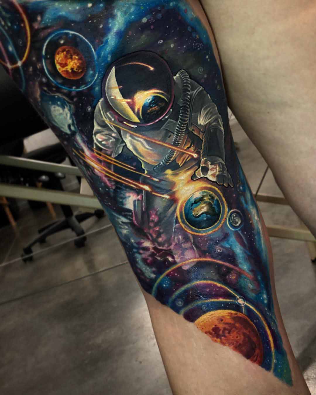 leg tattoo space astronaut