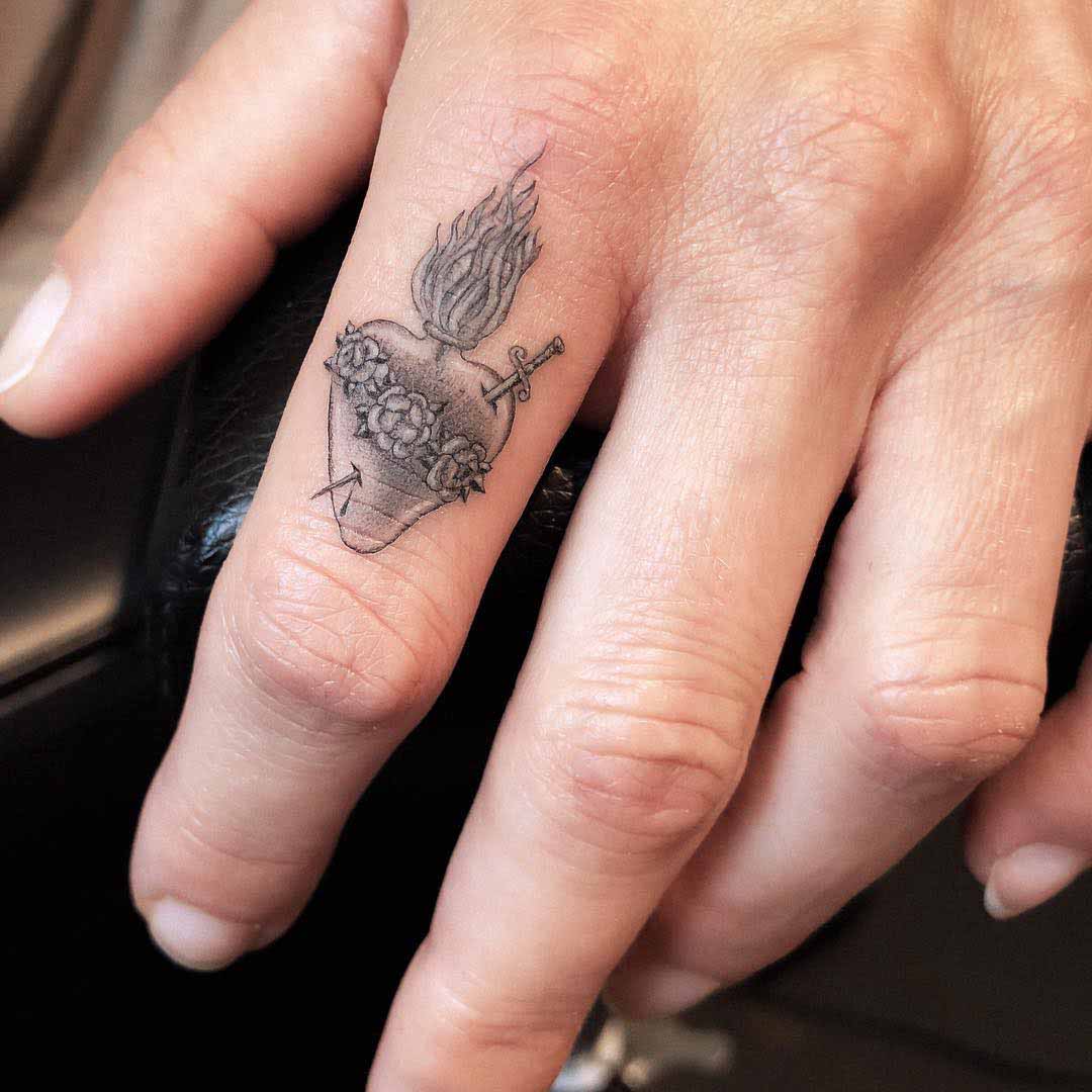 finger tattoo sacred heart