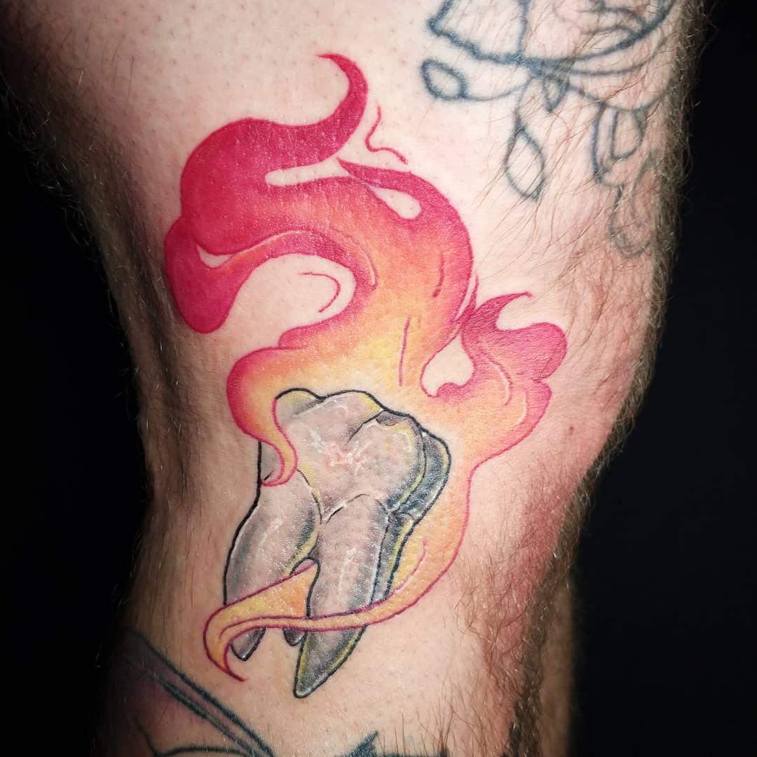 flaming tooth tattoo