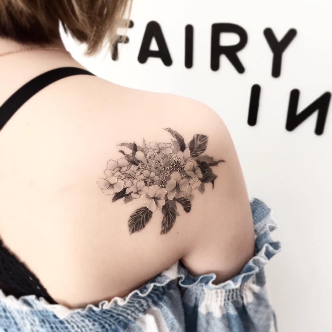 flowers tattoo on back of shoulder