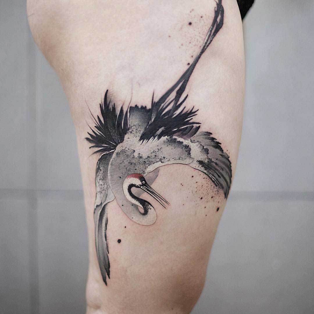 thigh tattoo crane