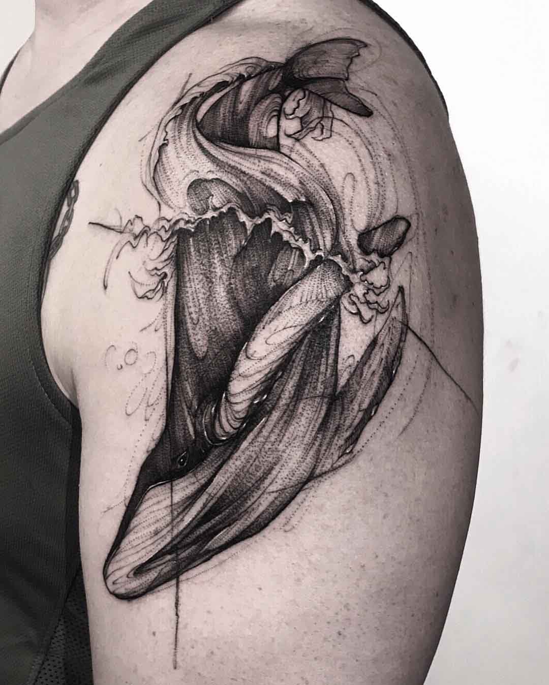 sketchy whale tattoo on shoulder