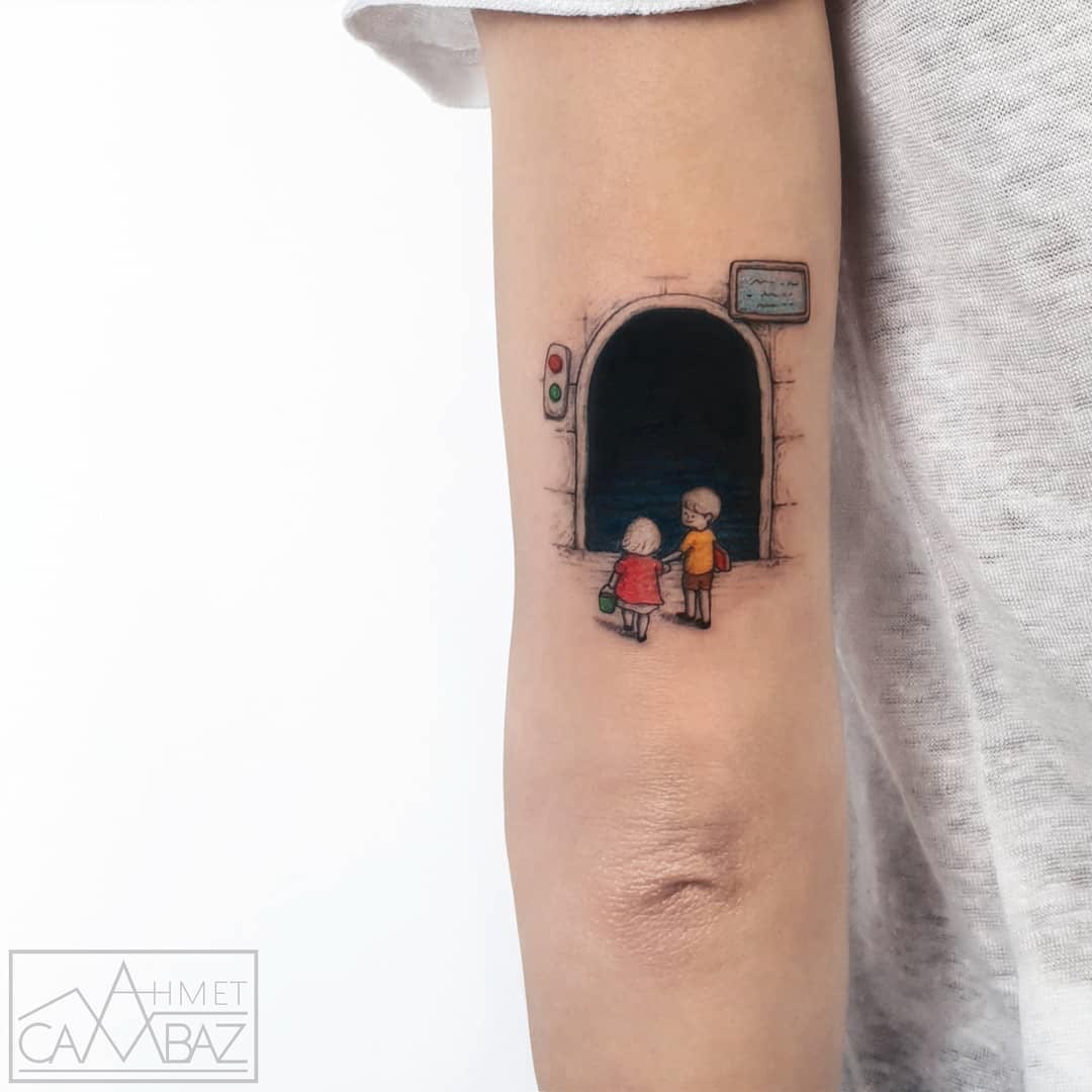 back arm tunnel tattoo