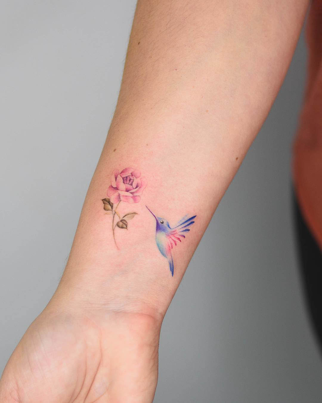 wrist tattoo hummingbird and rose